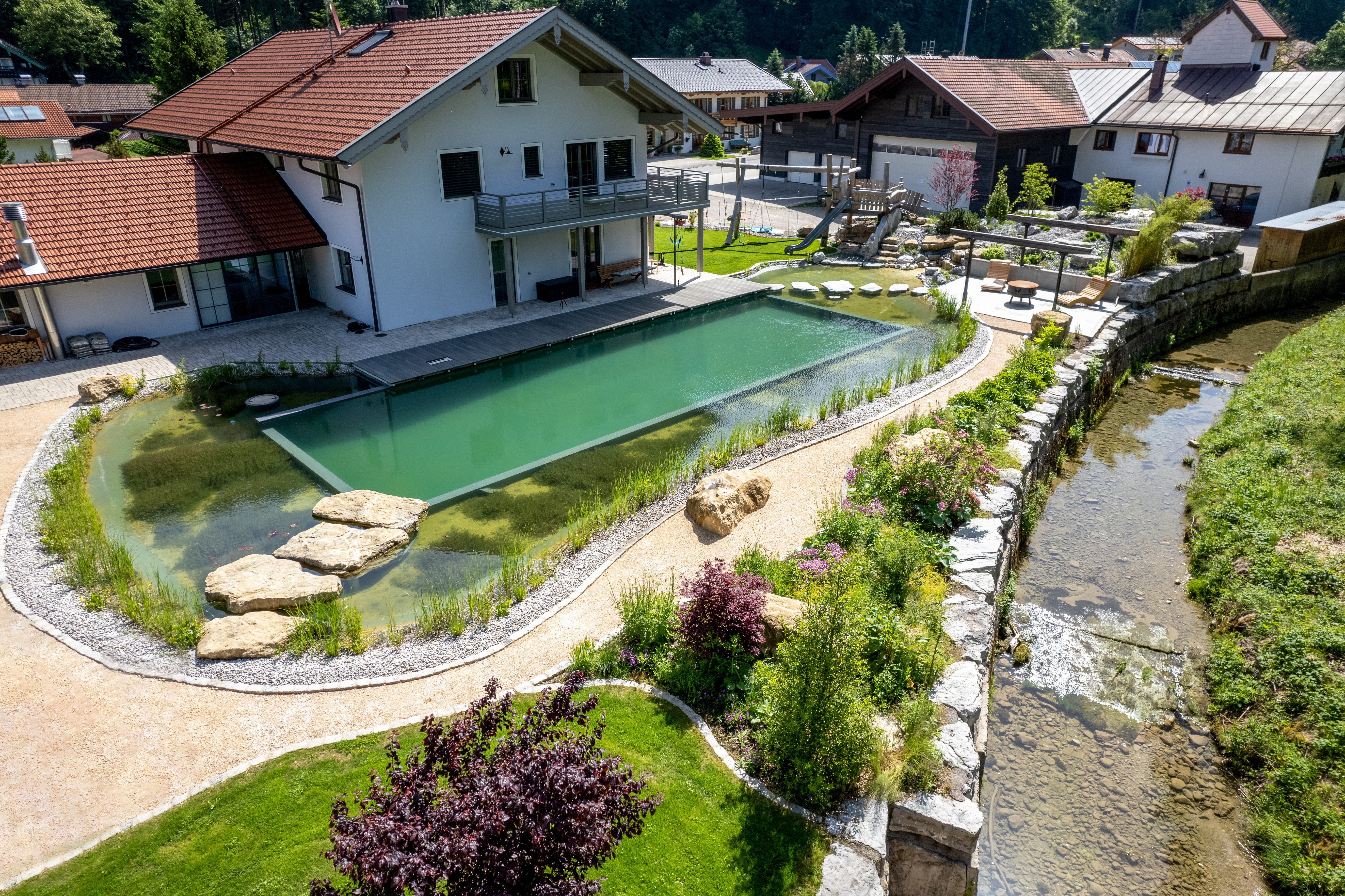 swimming-pond-with-stepping-stones-and-waterfall-Ruhpolding-DE-3
