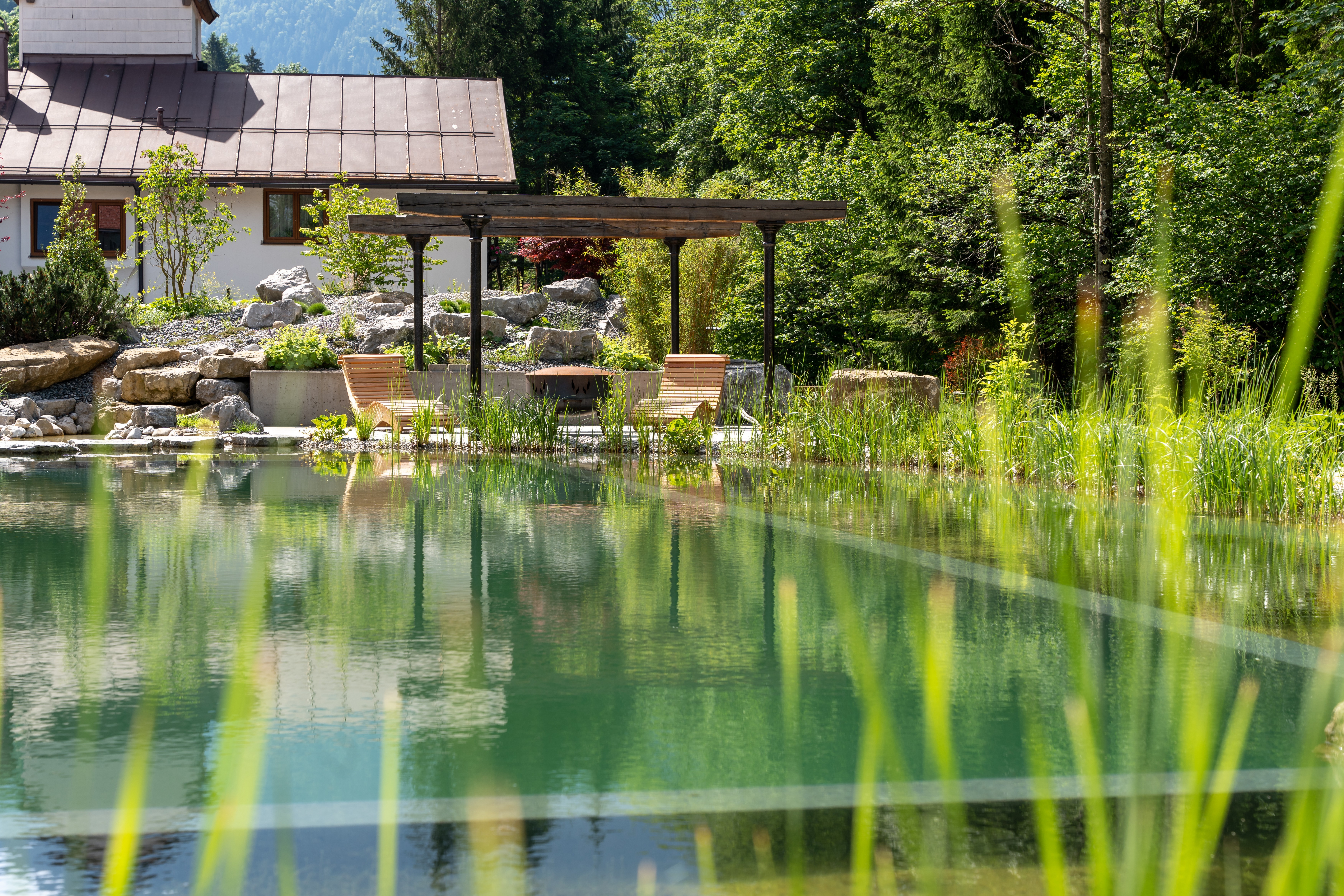 swimming-pond-with-stepping-stones-and-waterfall-Ruhpolding-DE
